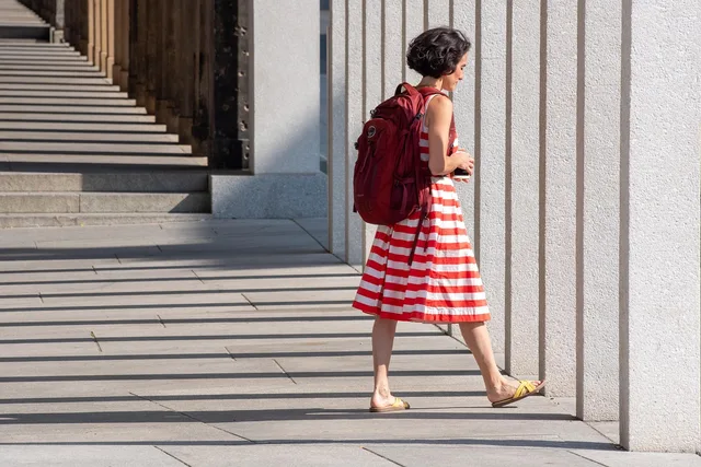 woman, dress, stripes, shadow, female, street, backpack, casual, outfit, stripes, street, backpack, backpack, backpack, backpack, backpack, outfit. Packing for museum trips: what to bring and what to leave